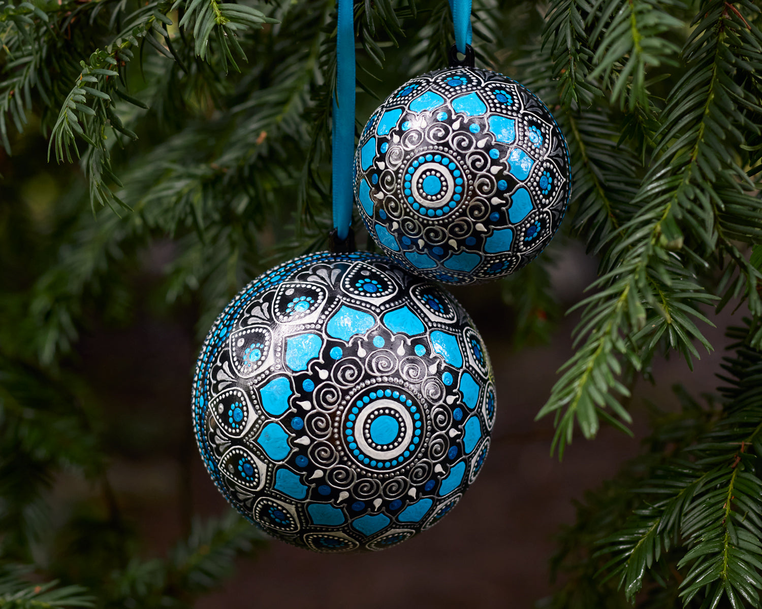 Two blue Christmas baubles different size