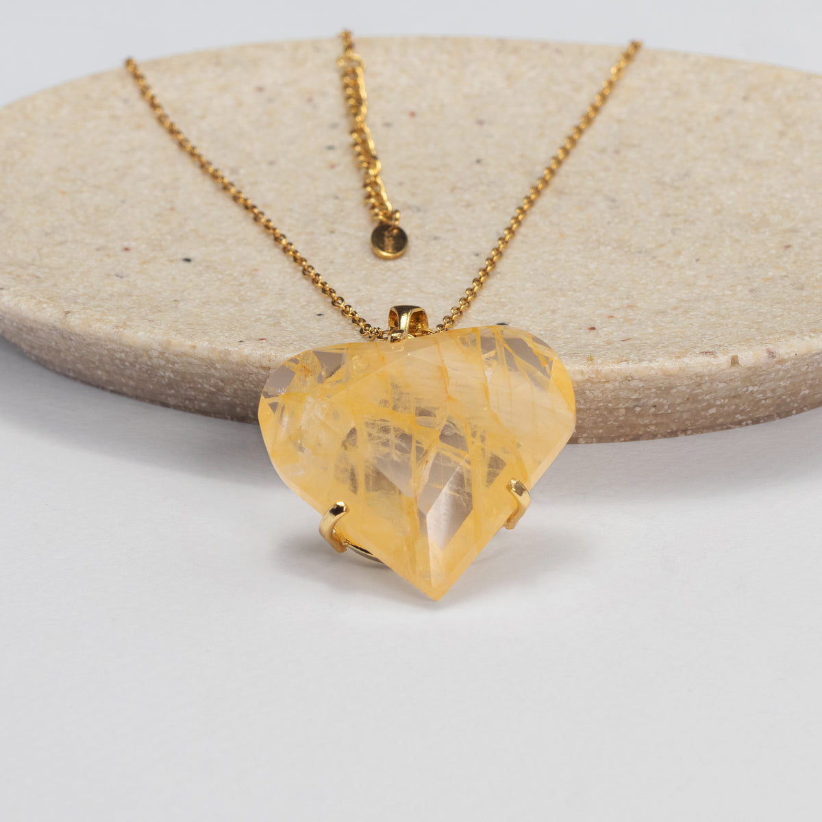 Golden healer faceted heart pendant