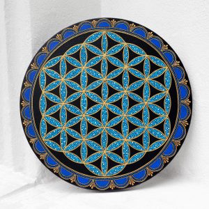 Flower of Life painted on a round canvas board, dot art technique, blue colors. Front view on a white background.